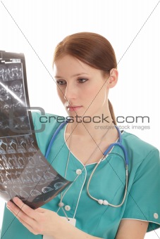 Female doctor looking at the xray picture