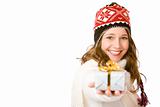 Young happy woman with cap is holding Christmas gift in hand