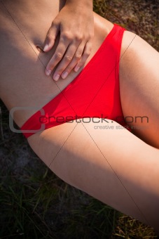 woman laying at the beach relaxing