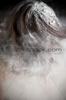 young woman covered in flour

