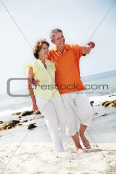 Happy mature couple on the beach