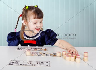Little girl playing with lotto