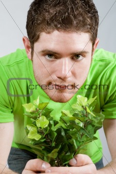 Man holding small plant