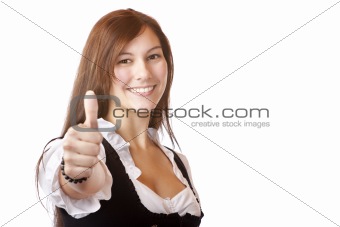 Young beautiful Bavarian woman with Dirndl dress shows thumb up