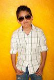 Handsome young Hispanic boy wearing sunglasses
