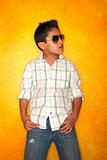 Handsome young Hispanic boy wearing sunglasses