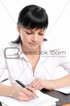 Woman sits at a table