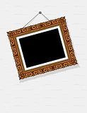 empty picture in decorative frame on wall