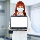 Nurse with computer in hospital