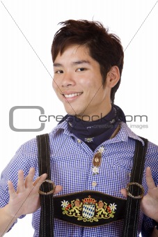 Young Asian in Bavarian Oktoberfest Leather trousers (Lederhose)