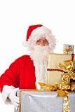 Old Santa Claus holding Christmas gift boxes in hands