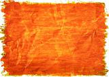 Orange paint on a crushed paper. 