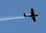 Airplane with smoke trail