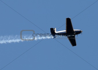 Airplane with smoke trail