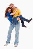 happy young couple - boy carrying girl in his arms - isolated on white