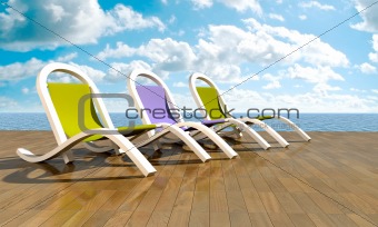 Deckchairs in front of sea