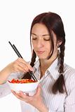 Beautiful woman eating with chopsticks