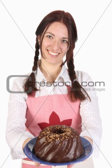 housewife showing off bundt cake