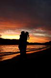 Couple kiss in romantic sunset