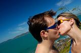 Couple kissing on sunny day