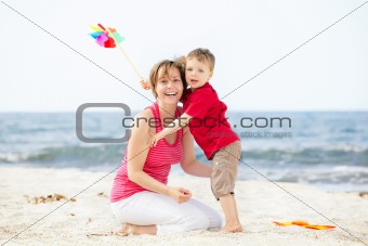 Happy mother and son on the beach
