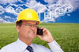 Contractor in Hardhat on His Cell Phone Over House Icon, Empty Grass Field and Deep Blue Sky with Clouds.