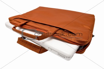 Orange bag and white laptop