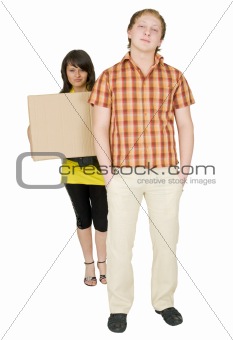 Woman and man bear the big cardboard box