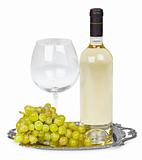 Bottle of white wine, glass and grapes on metal tray