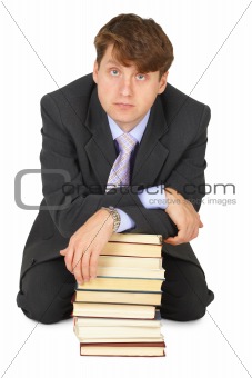 Young erudition man with stack of books