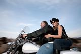 Couple riding a motorcycle