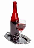 Red wine bottle and glass on metal tray