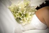 white flower bouquet on bride's back