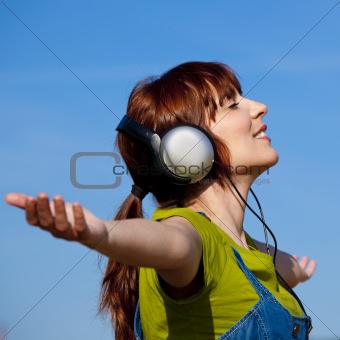 Happy woman listen music