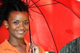 Black Woman Holding an Umbrella