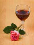 Glass of red wine and rose