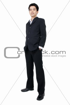 Full body of a smiling young Asian executive