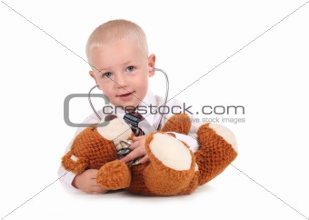 Sweet Little Boy Caring for His Teddy Bear