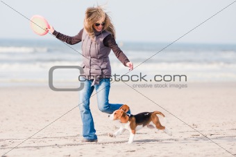 Girl playing with dog