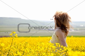 Girl in a rapeseed field