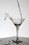 Water pouring in Martini glass