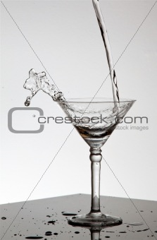 Water pouring in Martini glass