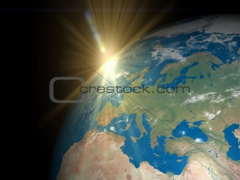 Earth with rising Sun over Europe and Africa