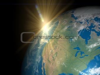 Earth with rising Sun over America