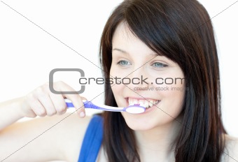 Jolly woman brushing her teeth 