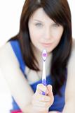Charming woman holding a toothbrush