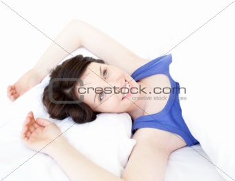 Close-up of a dreamy woman waking up slowly