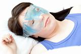 Brunette woman with an eye gel mask