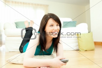 Jolly woman watching television