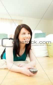 Attractive woman watching television